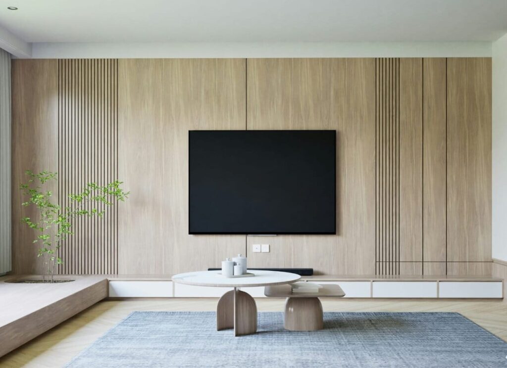 Przedstawia nowoczesny, minimalistyczny salon z drewnianymi panelami, szarym dywanem i elementami dekoracyjnymi.